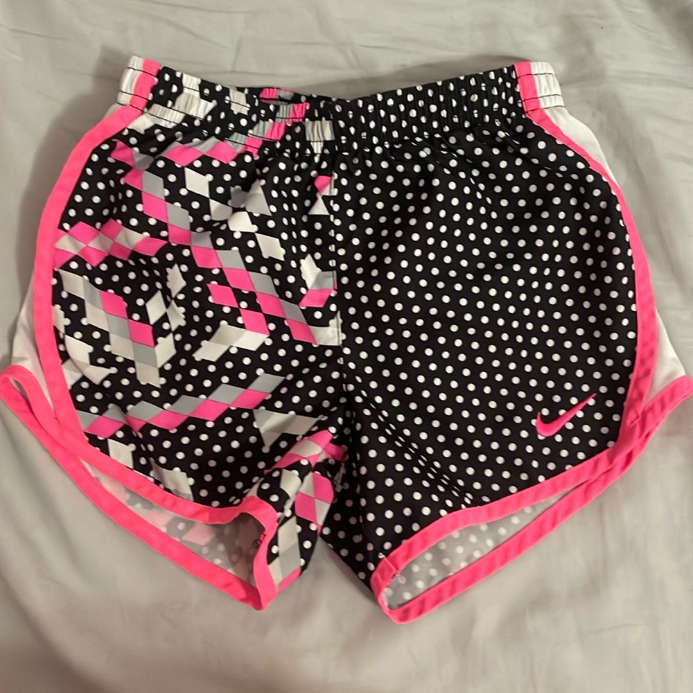 Pink, grey, black, and white Nike shorts